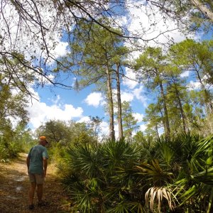 Casey (Dessert 1st) hiking on the nature trail.  Look at that beautiful Florida sky!