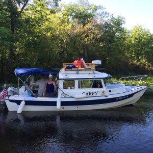 Carpy, owners Bruce and the \"other\" Joyce, :-), setting up camp on the Wekiva River.