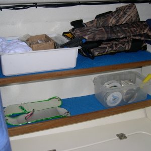 Starboard Shelves.  Idea, courtesy of another brat.  Top shelf includes two 1/2" x 2" slots for table brackets when dinette is converted to a bunk.