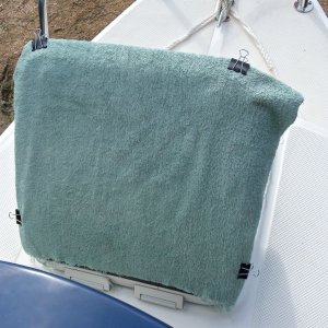 Poor man's sunshade. Towel and four binder clips