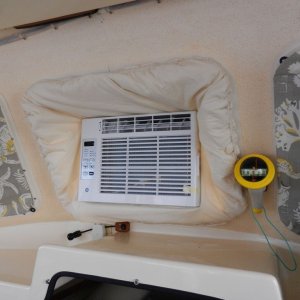 Here is the "in use" AC.  Kind of a cheezy '70's look with the fluffy opening cover, but I'll get used to it as it is blowing out cold air, I guess....