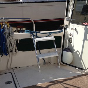 I installed Garelick cockpit steps that will mostly serve the port coaming (the side against the dock). But I also installed brackets on the starboard side -- in case. They are much easier to use than the built-in step.