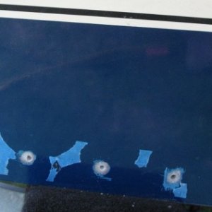 After filling with thickened epoxy and letting it cure, I tapped the holes for the fasteners.  The reason there are some raggedy bits of tape left on are because I had wanted to save a few of my reference lines.  I made the holes in the template with paper punch - that worked well for lining up the upper actuator holes when I went to re-drill.