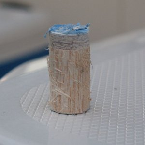 This is a "core sample" of the transom from where I overdrilled the holes for mounting the Mini Jacker.  At the top is the outer skin.  The reason there is no inner skin on the sample is that I just cut the large hole up to the inner skin but not through it.  I only made a fastener-sized (smaller) hole through the inner skin, so it's not attached to the core sample.