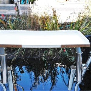 Fish cleaning/ Grill table can be mounted on second fishing pole mounts at anchor and stored out of the way in battery compartment when not in use.
