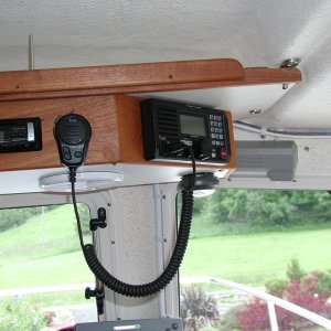 Shelf secured to offset added weight of Teak console for radios.
