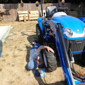 Loving the tractor wheel thinking I can pull myself up - NOT