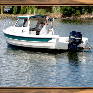 That's me in Jefferson Creek off the lagoons where I am moored. Headed out to Little Assawomen Bay and eventually where I met another 16' C-Dory.
A good friend took this with her new lens and she framed it to perfection.