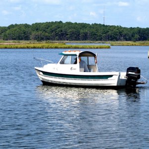 Shallow water cruiser.
Three feet max here when the tide is up, until you get out into the bay where it is four feet,maybe five.An adventure when the wind blows.
Jefferson Creek, Bethany Beach, DE.