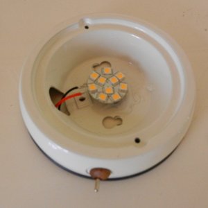 LED "puck" glued to old housing, wires and new switch installed