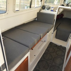 Dinette berth with factory-provided standard cushions.