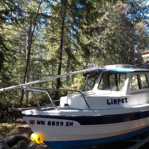 Four 10 foot lengths of PVC pipe laid between the cabin top hand hold and the "bump" in the CD 16 cabin top.