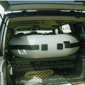 April 2006: Laid the seats down in the Astro Van & slid the dinghy in. Great fit!
