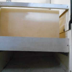 As 20 gals of water weighs 160 lbs, I used 3/4 marine ply and heavy duty aluminum angle bolted to the bulkheads.