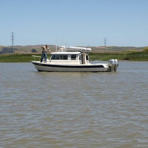 David of "Blue Eagle" dancing along the side of his boat - Look Pa, no hands.