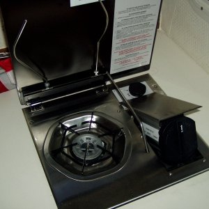 stove open with canister door open