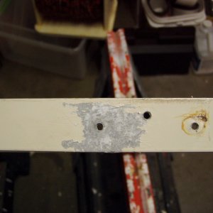 corrosion under hinge.