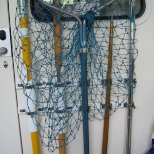Rack for net, gaff, boat hook, etc.
