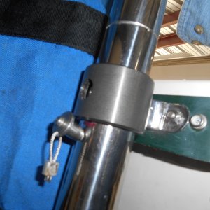 As I lifted the upper half of the mast, the lower mast section lifted out of the ball and almost fell overboard (in this case to the concrete floor).  The fix is an expansion pin that keeps the lower mast in place.