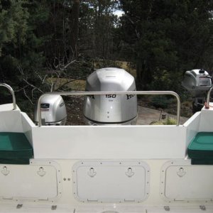 Transom shield - the rail is removable. Note the third hatch installed in the middle of the transom storage area which improves access.