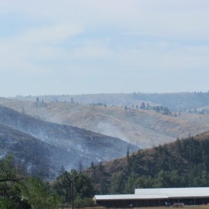 if you look closely at theleft hand side of the picture you can see the helicopter dumping water on the fire