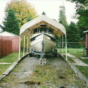 *Drifter's* new home for the winter.Tight fit,radar dome just clears the top.This shelter has sides/back and front,there is also a complete cover for the boat.She will be warm/dry and safe untill next Spring.0ct.17/09