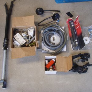 Transom saver( with spring shock absorber, never seen one before),muffs,hoses and assorted boat hardware.