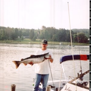 Salmon Fishing ( 2003 ) in the Ste.Marys River,Ontario,Canada....that is Sugar Island. Michigan. USA in the background.