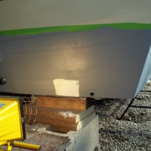 4/24/11..used Marine-Tex to fill screw holes/heat lamp to help in curing/applied 1st coat of ( Grey ) InterProtect 2000E