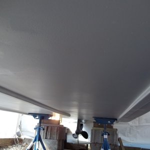 4/25/2011..2nd coat of Interprotect (white) applied...who says wax paper doesn't stick/i had to sand out the wax paper from my hull.Love those boat jack stands,makes life alot easier.I will buy two more.
