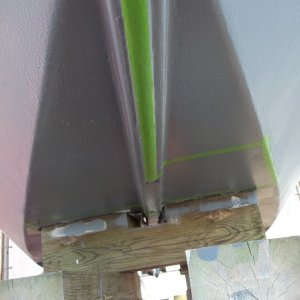 4/5/2011..this morning i taped off half the boat for bottom painting,this method also lets me pre-paint the locations where the boat stands will be.