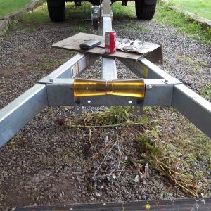 14/09/2011..went to the dealers and picked up my trailer and installed a 12 inch keel roller.( one that i had at home )..dealer was going to install a smaller one.( which he had ordered and i was expected to pay for ). to fit the existing holes because he said drilling new holes would cause the trailer to rust.