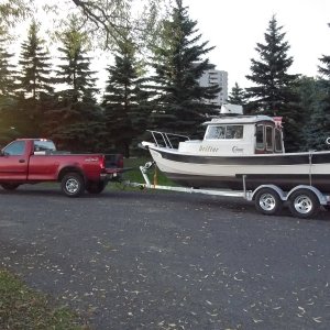 04/10/2010 Pulled my boat for the season while the weather is warm enough to do some bottom painting. Tomorrow i will put the front trailer jack on a bathroom scale to check the tounge weight.I think the axiles need to be moved forward about six inches.There seems to be more weight on the forward tires.