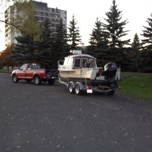 04/10/2011..not to trilled about my new ez-loader trailer.Rides so high!!!Rick Norman from ez-loader says my boat ( sent him a picture ) is loaded correct but i need to take the front ends of the bunks up a notch so the the boat just clears the roller/really shouldn't be any weight on the front roller