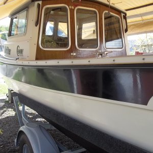08/10/2011..used 3M Marine Rubbing Compound than Collinite's No. 925 Fiberglass Boat Wax on the Black trim...by hand.I got a shine but there are still streaks embedded into the 1985 gel-coat