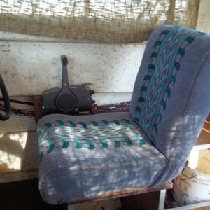 New Helm seat for $10.00 from a friends boat. It's all springs , way better for my back. Seat came from the Freedman Seating Co. Year 03/15