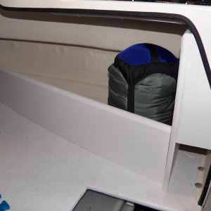 Storage is an issue, so I used the rest of the Azek board to make a storage cubby in the V berth.  The little cubby next to the helm is dedicated for a first aid kit and ditch bag.