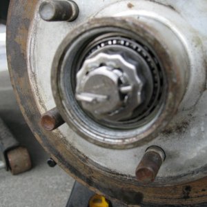 Tighten the wheel bold tells it?s good and snug, than back it off about 1/8th to 1/4th turn.
Install lock ring and a new cotter pin.