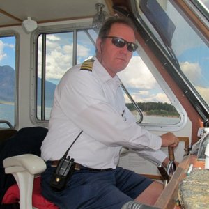 At the helm of the cruise boat