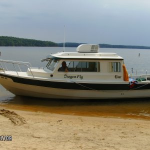 Captain Larry on the Dragonfly beached at Jordan Lake, NC