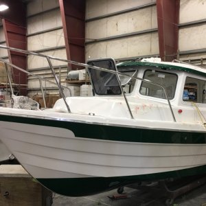 Over in the rigging area, a green stripe Venture 23