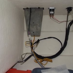 Under Helm seat before autopilot