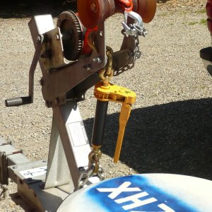 OOOPS INSPIRED: Added 7100Lb W/L heavy equipment ratchet chain binder (foldable handle) to tie down front end as second safety chain. Secured to bow post and main trailer beam with 1/2" galv. chain. Should not come up again (or forward) unless I lose the bow eye. Chain is linked under trailer with a full oval screw on connector and locked with a padlock as anti theft precaution. I'm not intending to put this in a thread until it has been well tested.