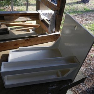 Here is the drawer painted and almost ready.  As I was measuring things, there were a few extra inches on the side of the cooler - I couldn\'t let that go to waste!  I made some shelves for storing cans alongside.