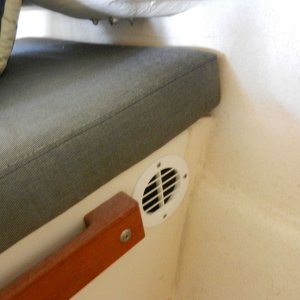 I put two vents in with the louvers facing up for heat removal.  This one is facing forward at the co-pilot seat.
