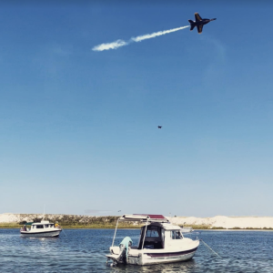 Blue Angels flying over two C-Dorys. Ft McRee, Pensacola Fl