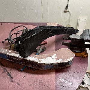 Unfinished roller laying on the mold it came out of