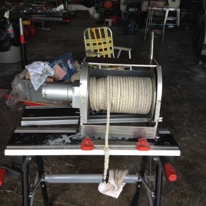 The two side pieces that have the screws left in them cannot be welded. 8x32 screws tapped into the end plates work great for holding them in place. They keep the rode from slipping down between the drum and sides in case you overfill the drum. Holds 300 ft. of 3/8 rode and chain.