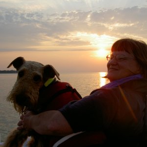 Marcia and Boomer on a sunset dinghy ride / Pelee Island, Ont. / Lake Erie