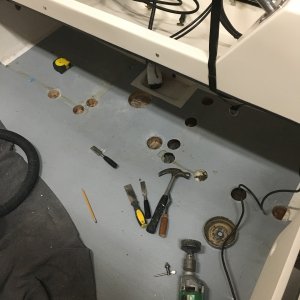 Had water intrusion into the balsa core where the gas tank brackets were screwed in so I drilled those areas out with a hole saw.